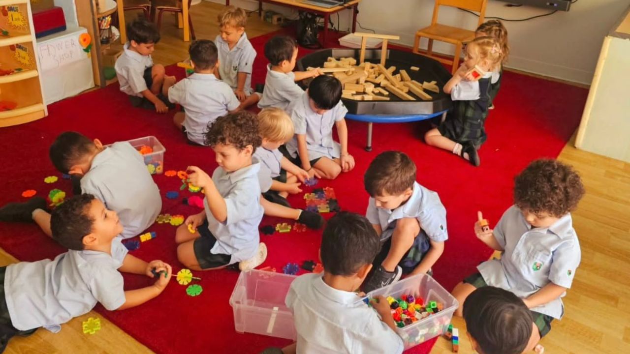 Children engaging in educational activities at Dubai International Academy Emirates Hills.