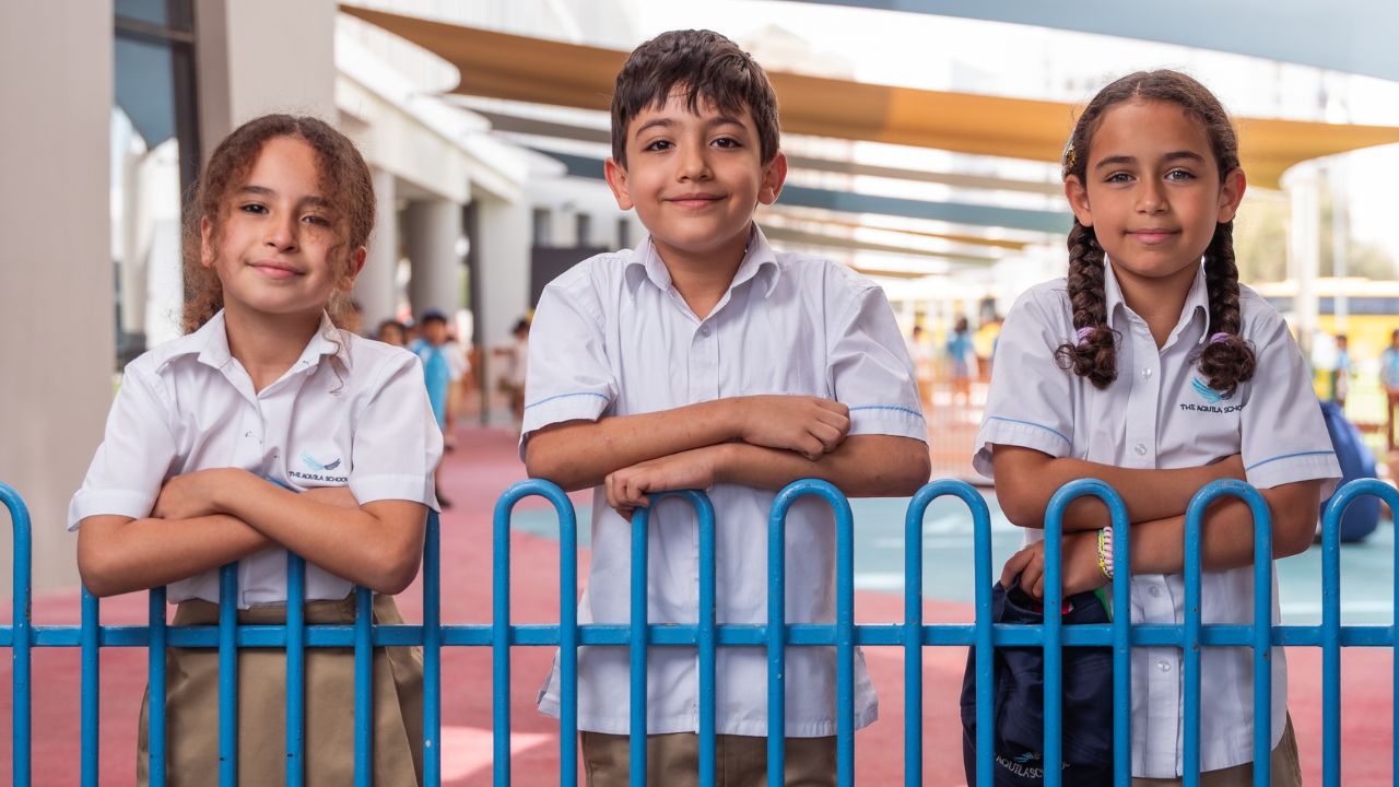 Happy students at The Aquila School in Dubai, enjoying outdoor activities.
