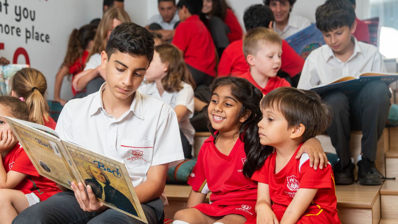 Young students reading in classroom at The English College.