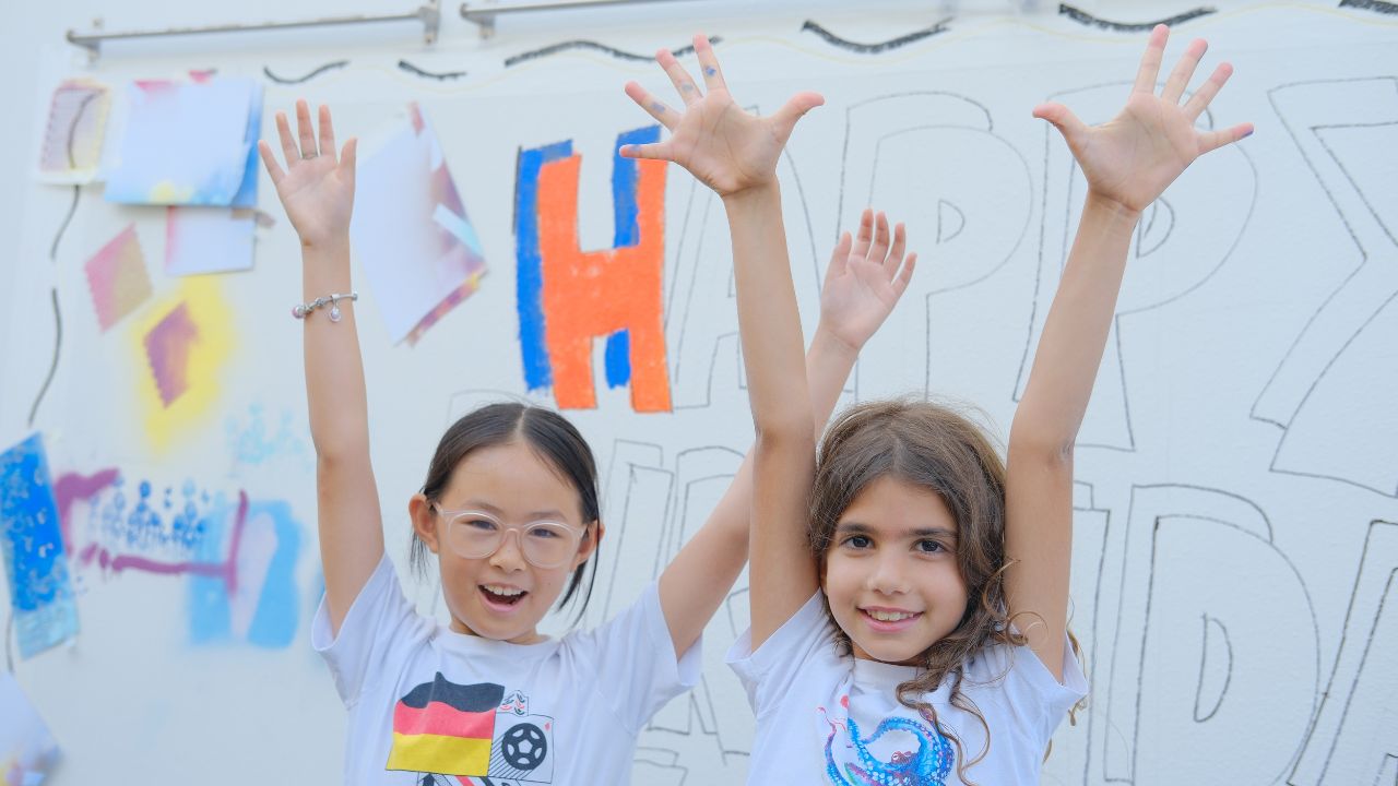 camden art students raising their hands with enthusiasm