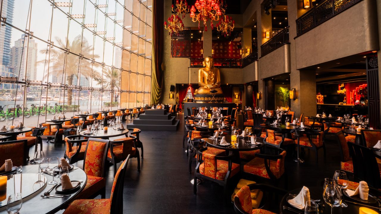 Elegant Buddha-Bar Dubai restaurant interior with Asian decor and ambient lighting.