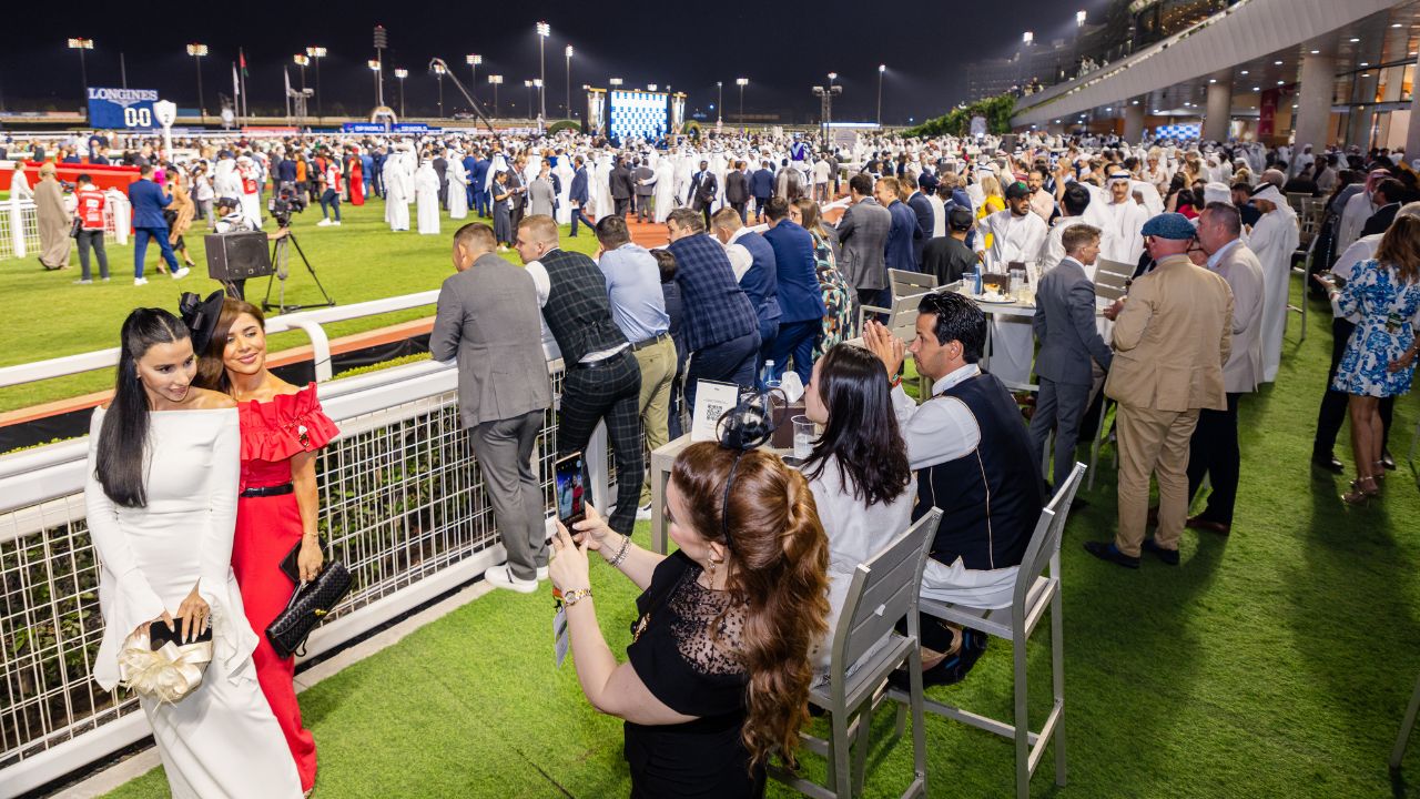 Excited spectators at Dubai Racing Club enjoying the 2025–26 season launch.