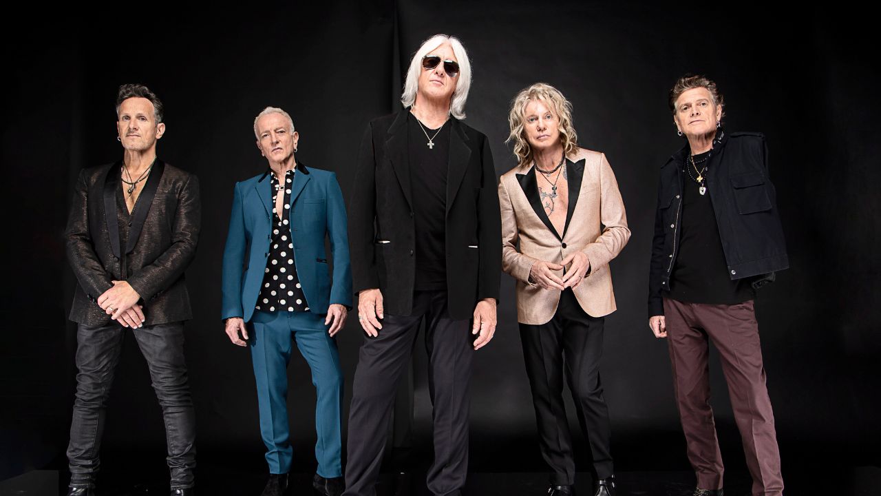 Def Leppard band members posing for a photo in Dubai.