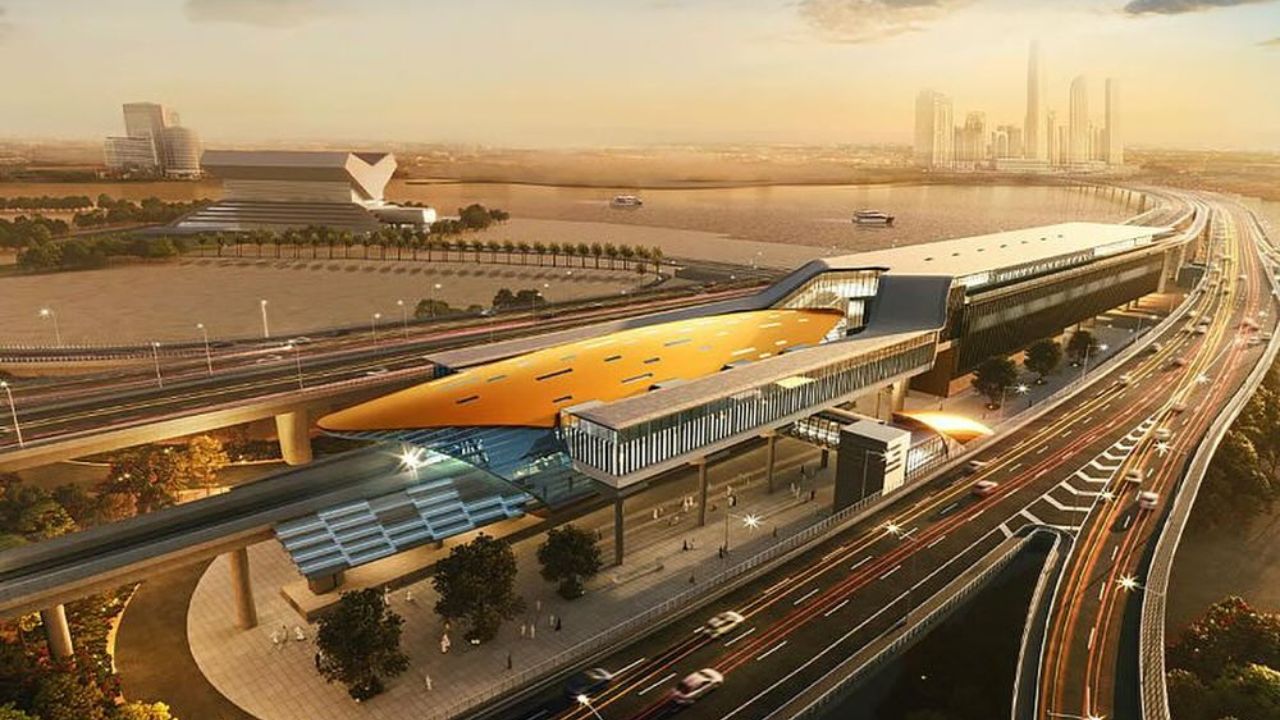Modern Dubai Metro station with elevated tracks and surrounding roads.
