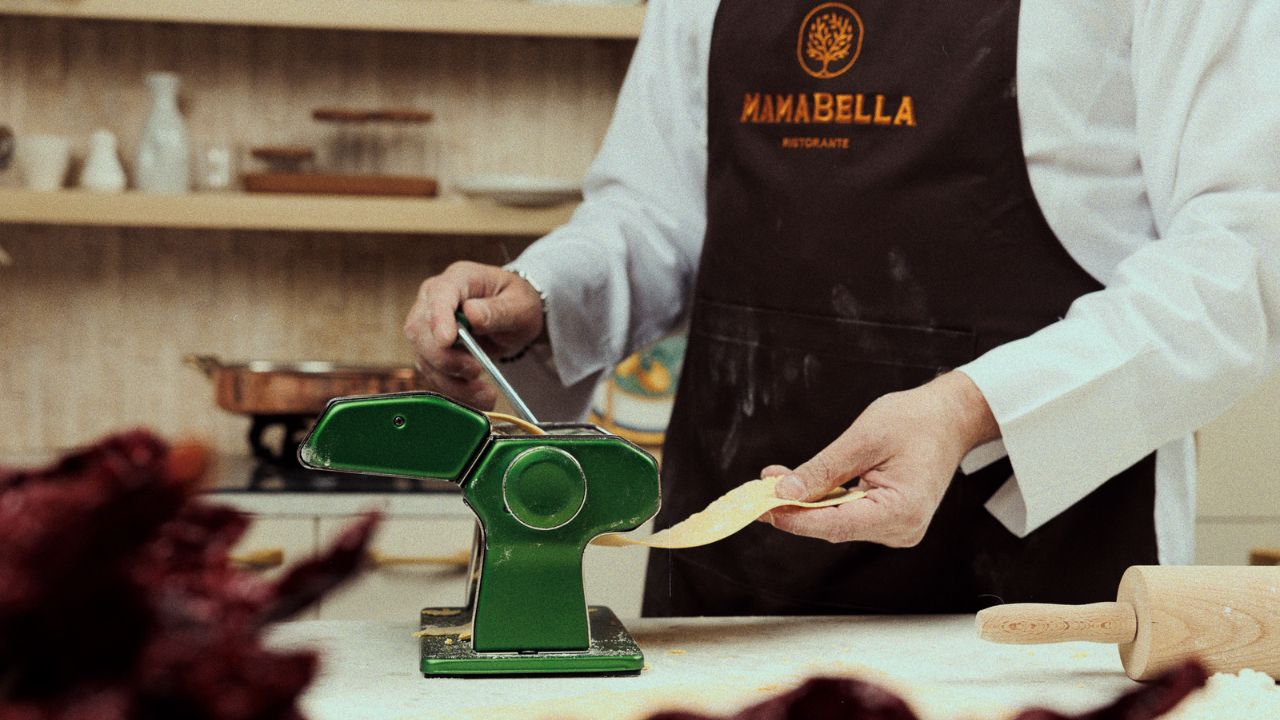 Chef preparing fresh pasta at MamaBella restaurant in Dubai.
