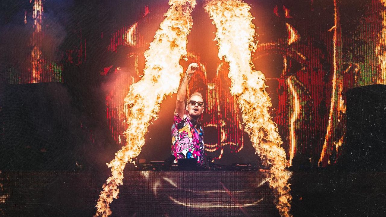 Female DJ performing with fire effects at Bohemia Club Dubai.