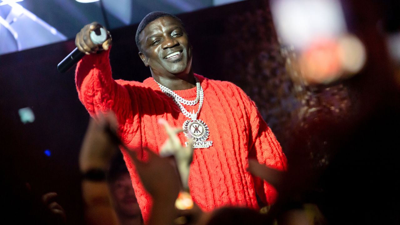 Akon performing live at Dubai event, showcasing his iconic music and vibrant stage presence.