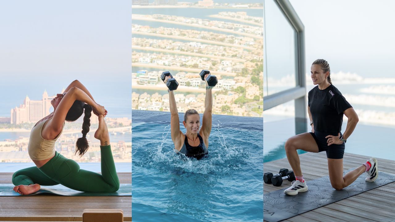 Yoga pose on rooftop with Dubai skyline in background.