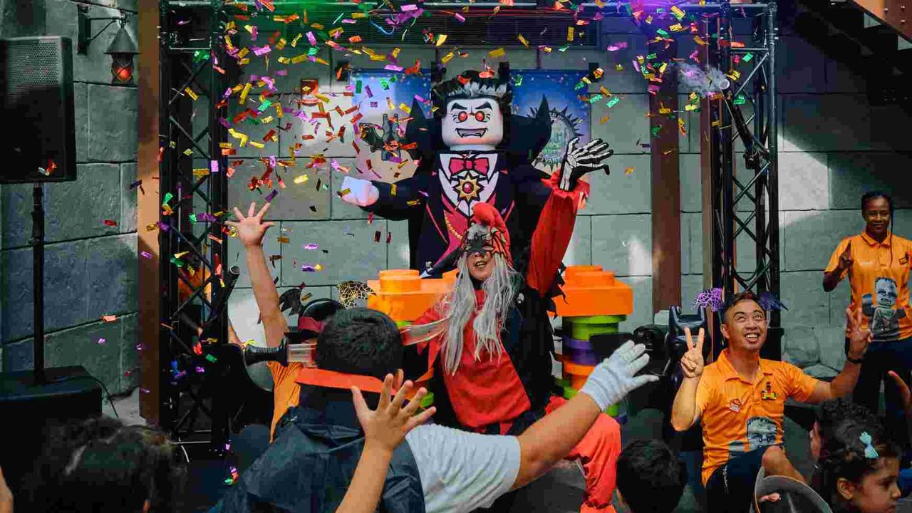 Vibrant children’s entertainment event in Dubai with colorful confetti and performers.