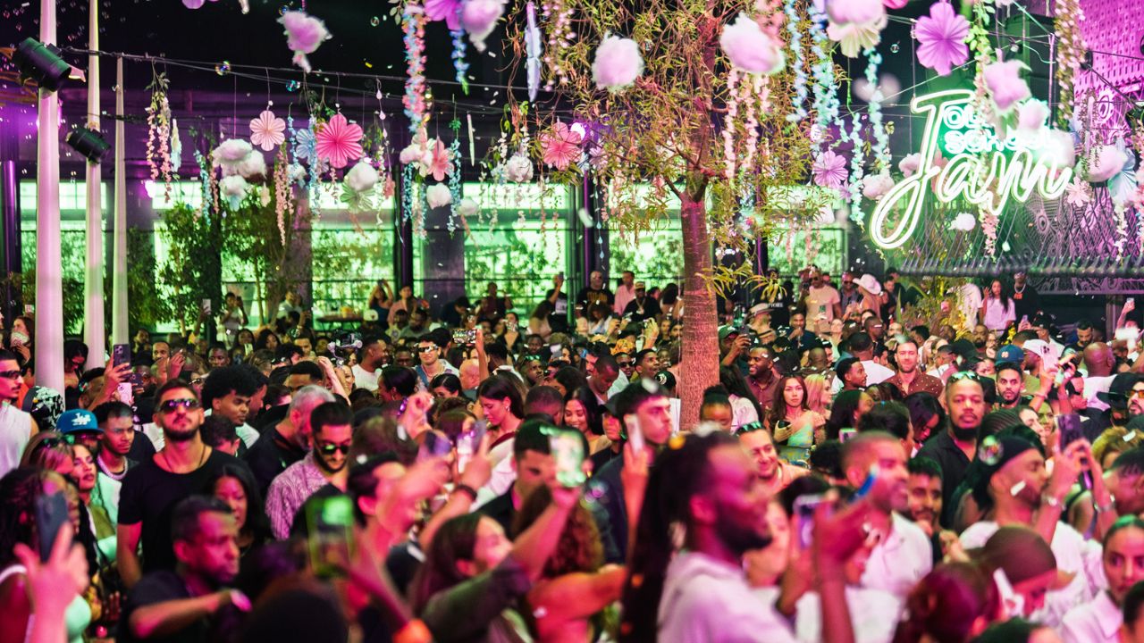 Vibrant crowd enjoying Old School Jam Winter event in Dubai with colourful decorations and lively at.