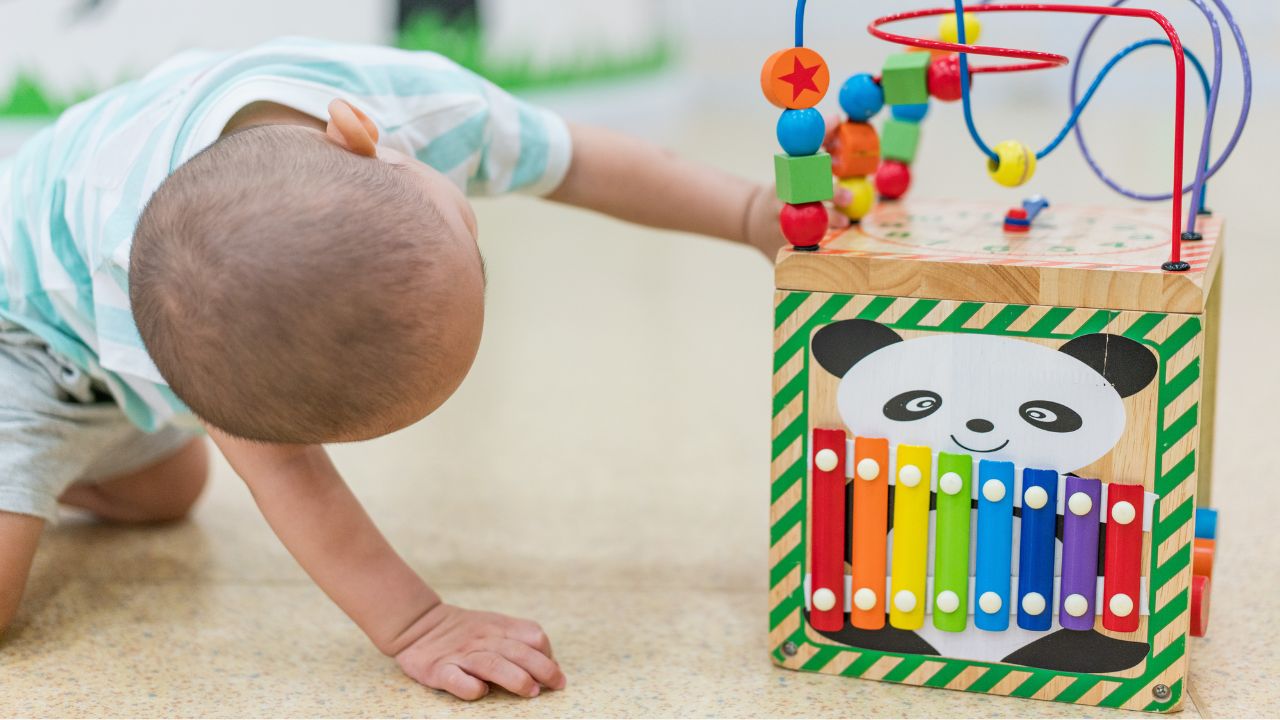 Panda-shaped educational toy with colourful beads and wires for early childhood development.