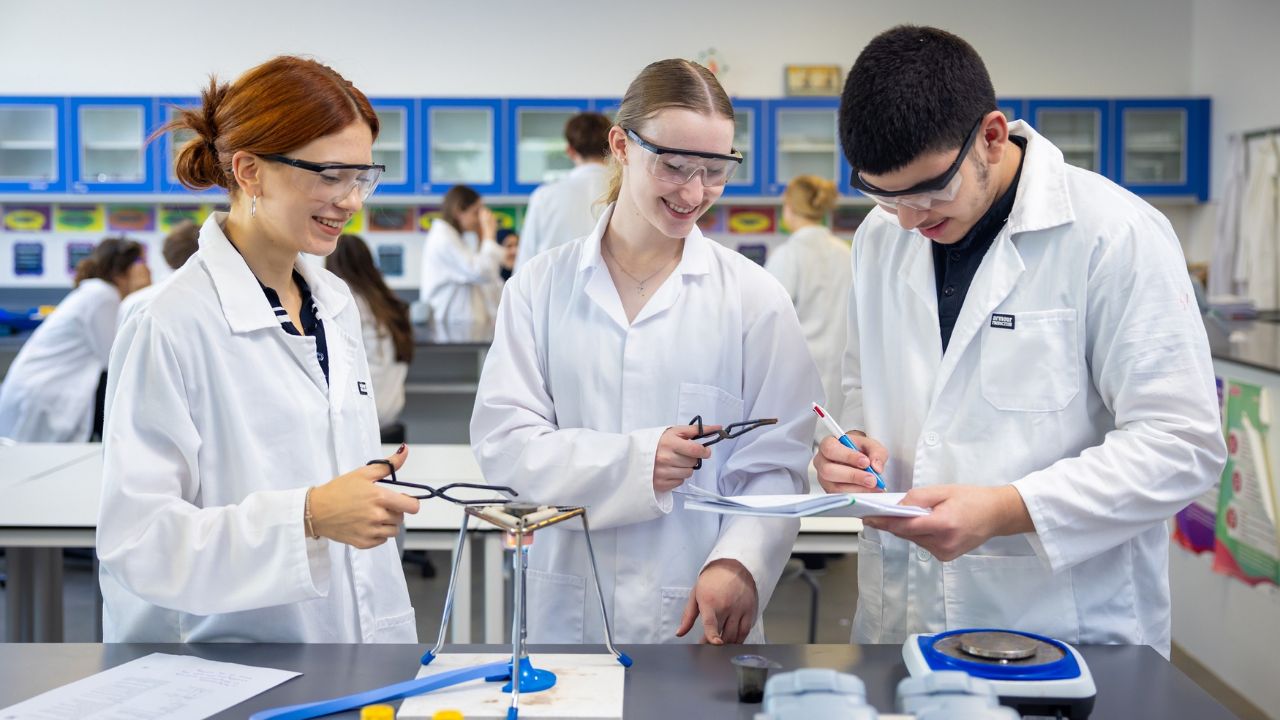 Students conducting science experiments at Swiss International Scientific School Dubai.