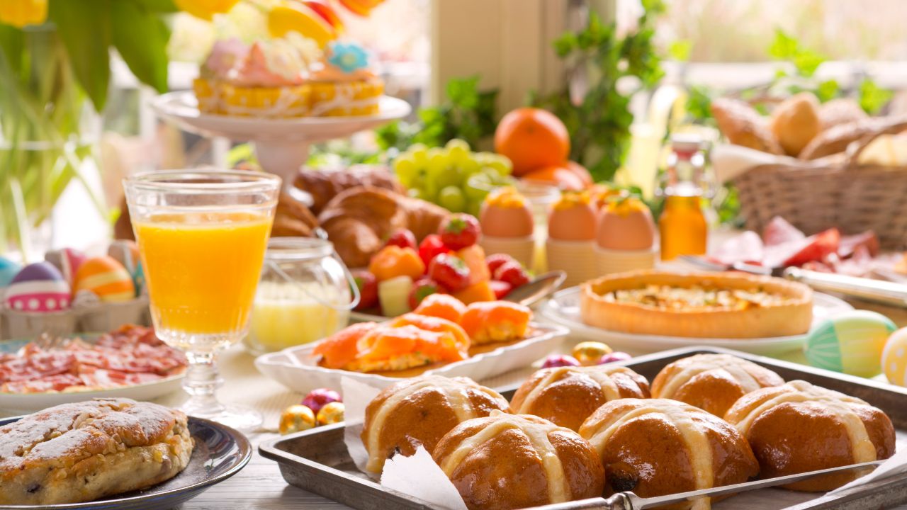 Easter brunch table with eggs, pastries, fruits, and drinks in Dubai.