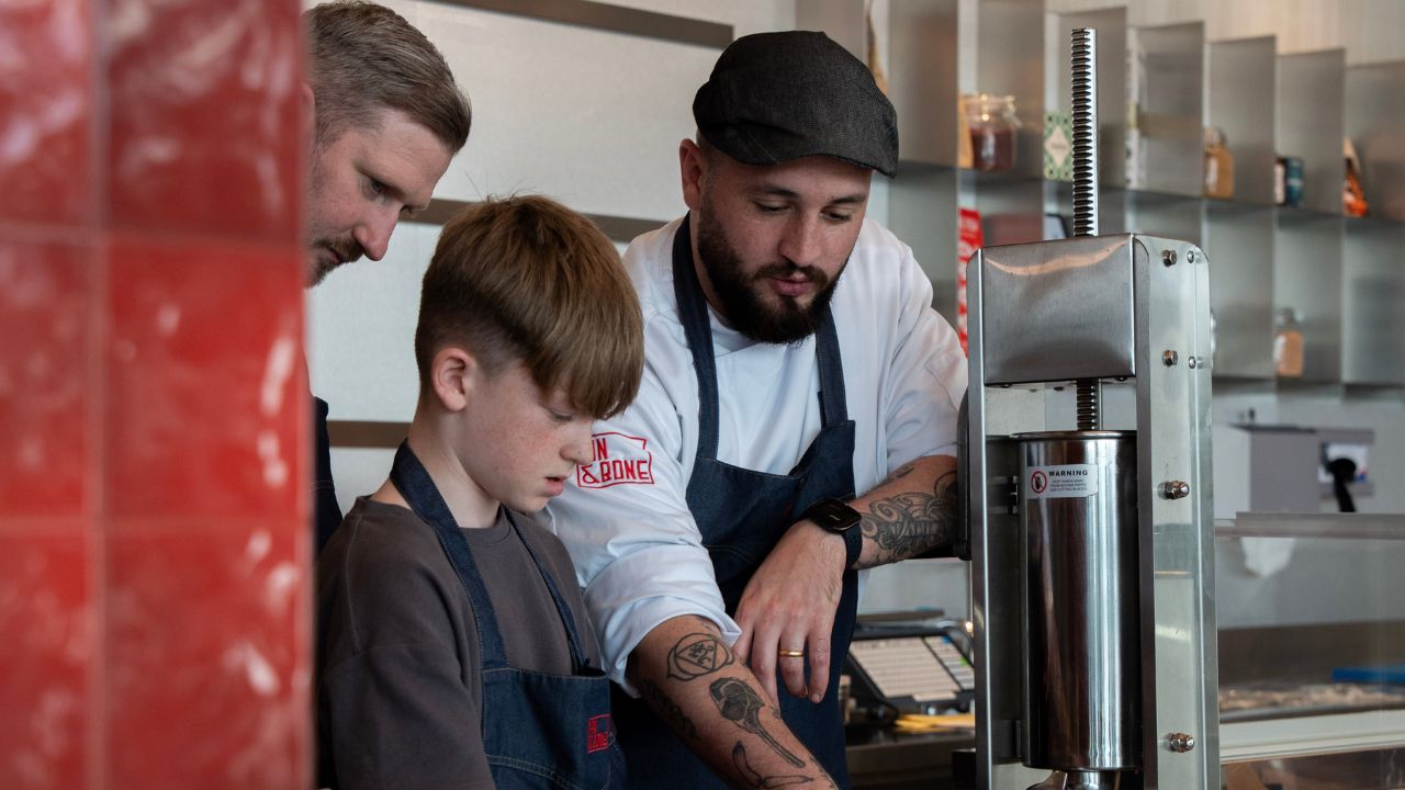 Kid making sausage in a masterclass