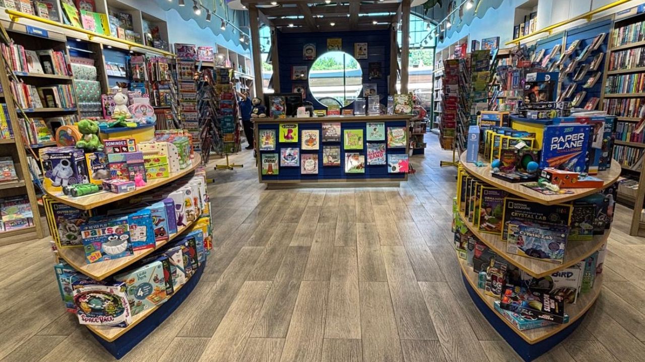 Bright Dubai bookstore interior with children's books and toys.