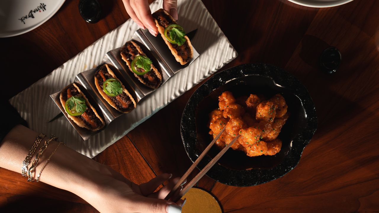 Delicious Asian street food with skewers and crispy snacks.