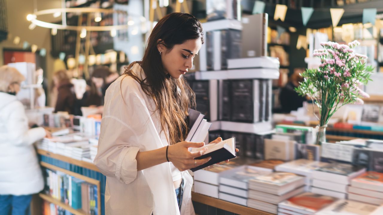 lady reading a book in the bookstore