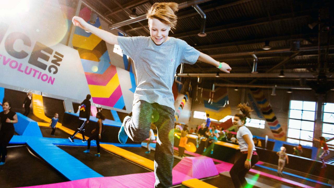 boy jumping on trampoline