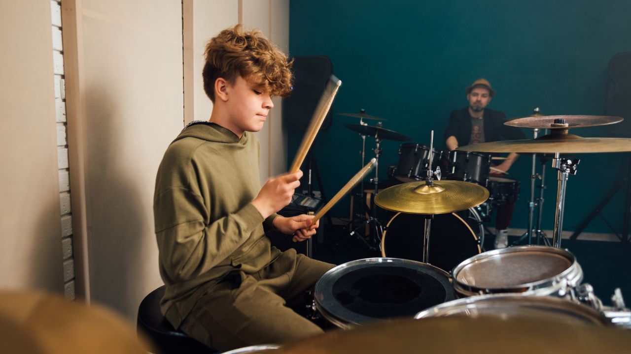 kid playing the drums