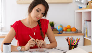 feature image of a teacher planning her lesson