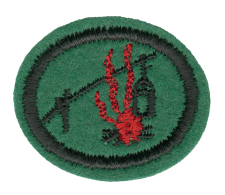 Feuerwehr-Emblem aus Stoff, rund, grün mit rotem Feuer und schwarzem Kreis, Symbol für Brandschutz und Sicherheit, ideal für Feuerwehr-Training und -Ausbildung.