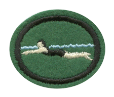 Grün, schwarzes und weißes Stickerei-Design auf Polstermatte, die im Zentrallager für Textil- und Stickerei-Produkte gelagert wird.