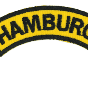 Hamburg Warehouse Patch with black embroidered text on yellow background, representing a branded clothing or accessory patch for Hamburg-themed merchandise.