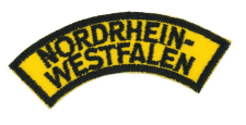 Zentrallager von Nordrhein-Westfalen-Westein, Logo mit gelbem Hintergrund und schwarzen Buchstaben, Lagerverwaltung, Logistik und Verteilzentrum, Unternehmenskennzeichen und Branding, emblematisches Design.