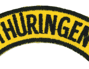 Thüringen Logo Stickpatch, zentrale Lagerverwaltung, hochwertige Textilstickerei, Bekleidung und Merchandising, regionaler Bezug, Markenqualität, Textilveredelung, Firmenlogo, Werbung, Vereinskleidung, textile Werbemaßnahmen.