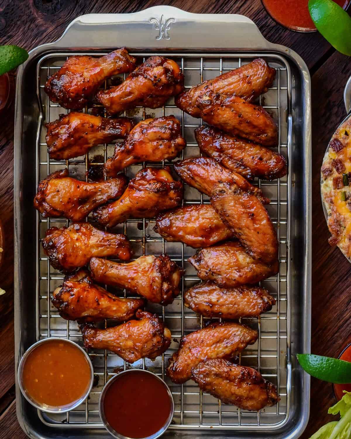 A sheet pan with crispy oven baked bbq chicken wings.