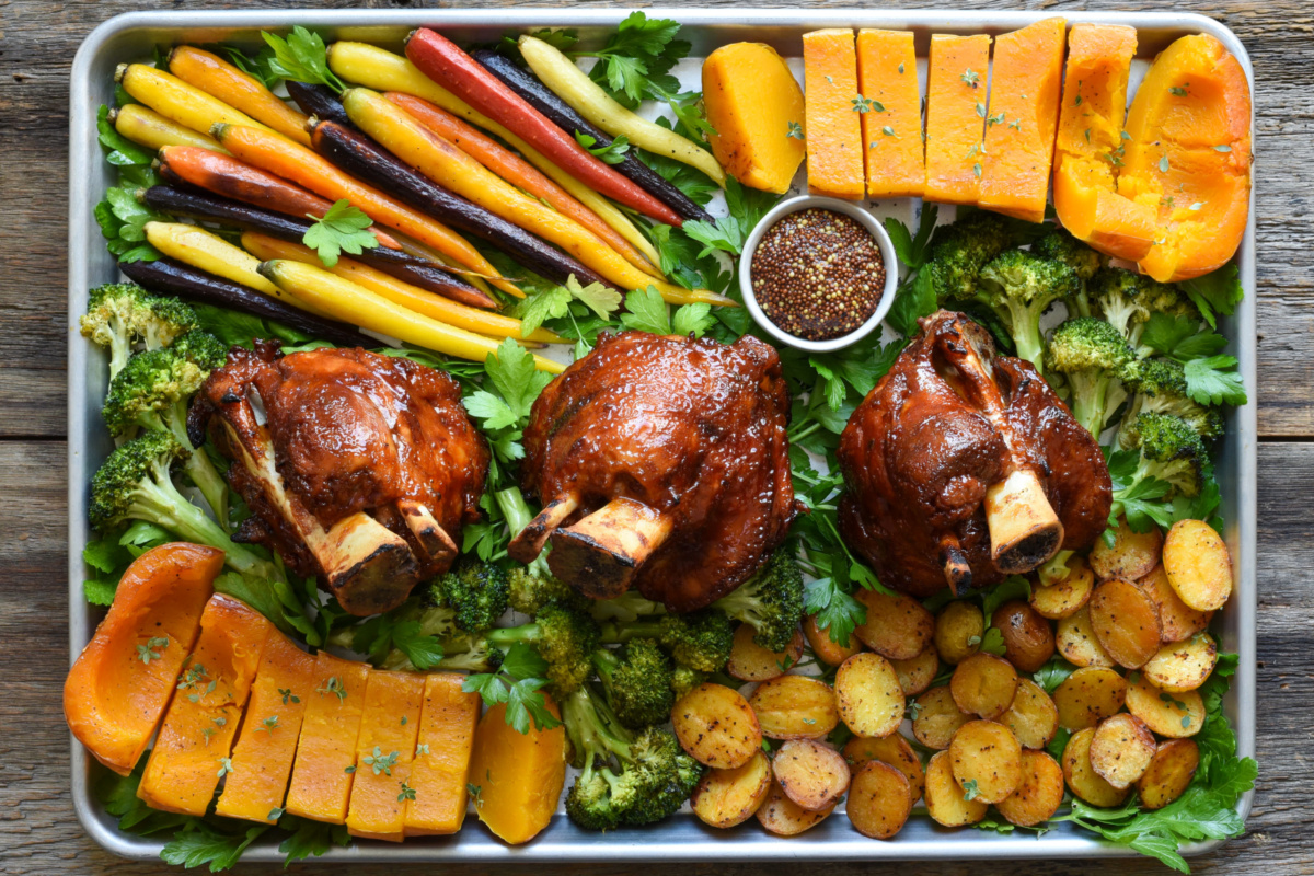 BBQ pork hocks served with a side of grainy mustard and our favourite Bomba Potatoes and roasted vegetables.
