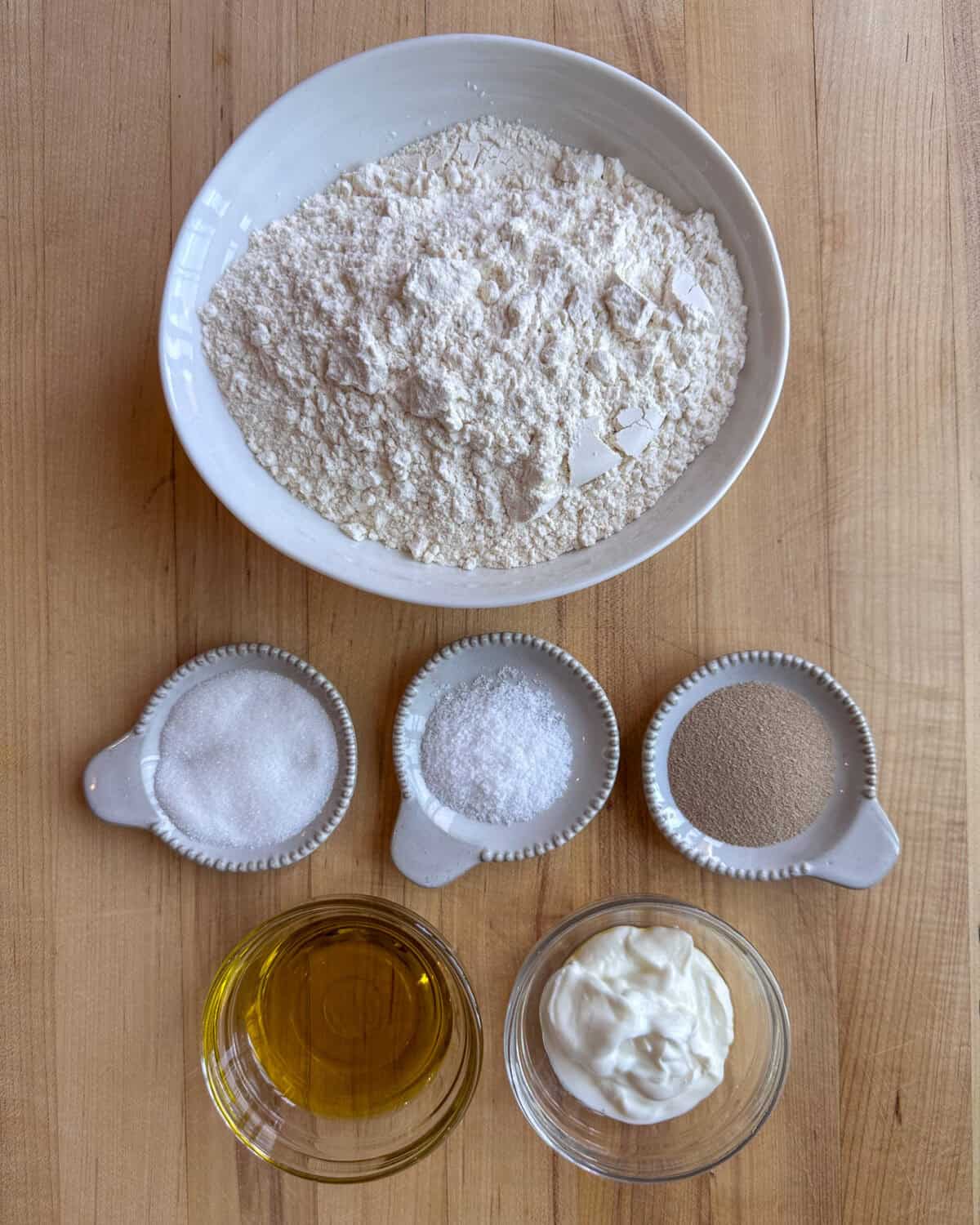 Ingredients measured out for a skillet flatbread recipe.