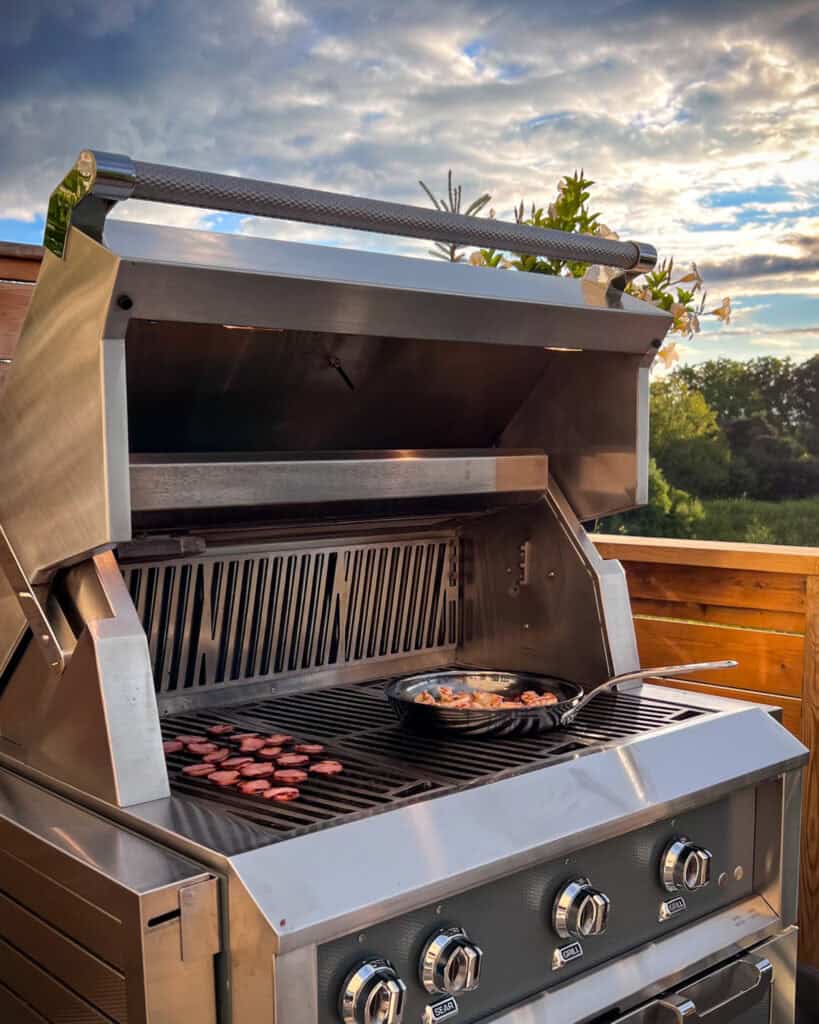 A skillet of Gambas al Ajillo plus some grilled kielbasa, both made on my Hestan grill.