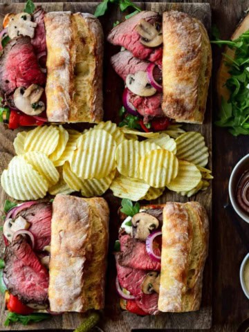 Four Ultimate Roast Beef Sandwiches served with ripple chips.