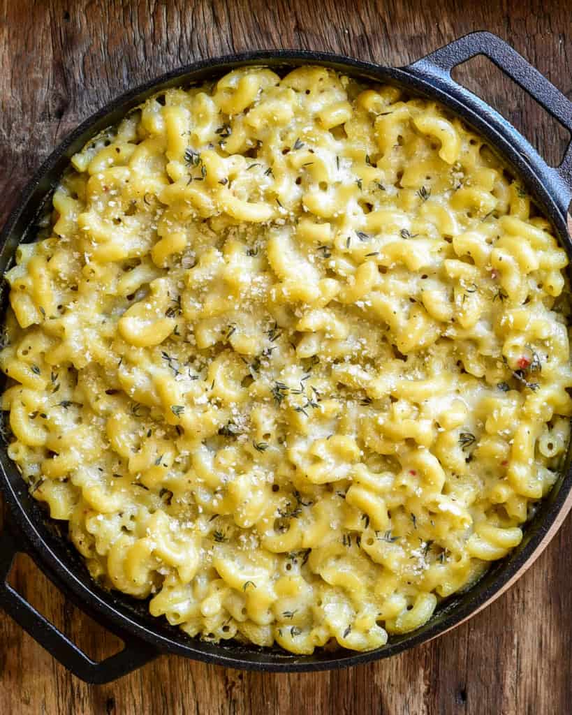 Macaroni and cheese in a cast-iron skillet.
