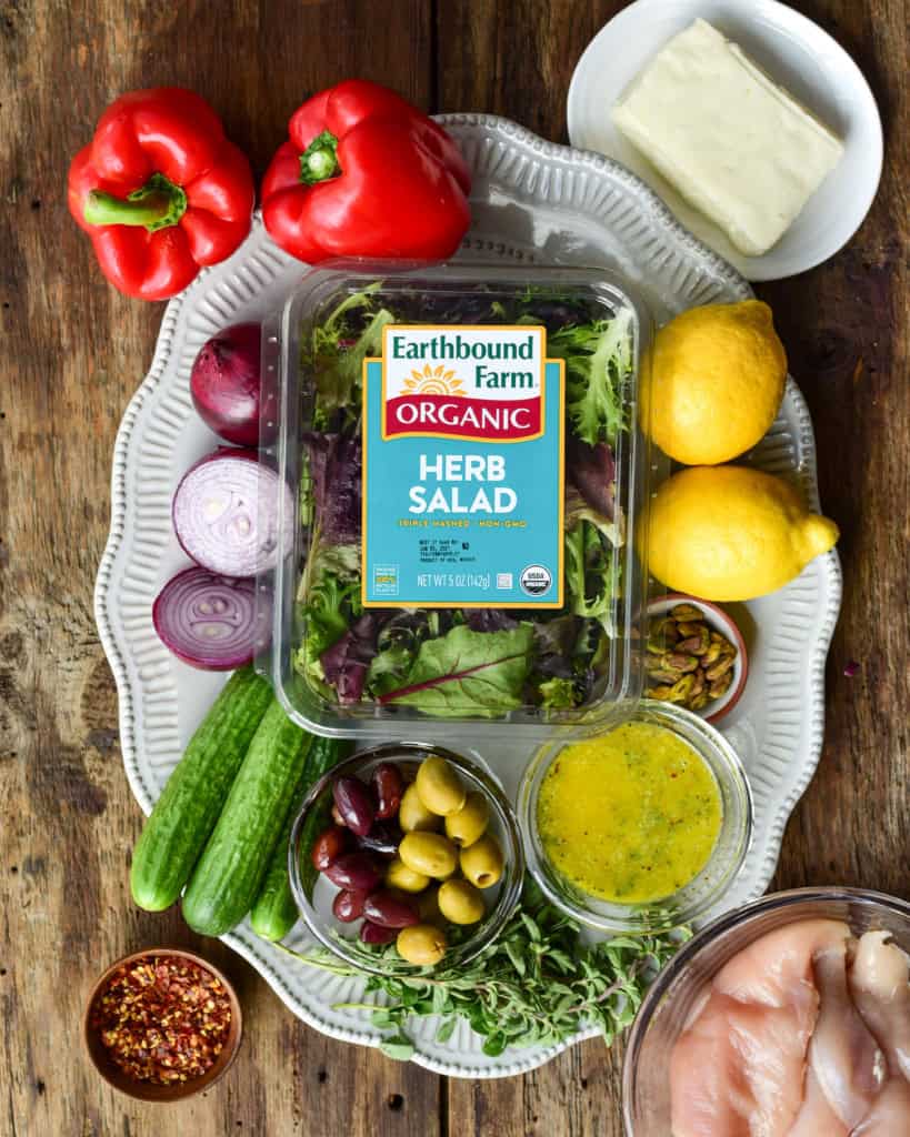 Ingredients for a grilled chicken and halloumi cheese salad.