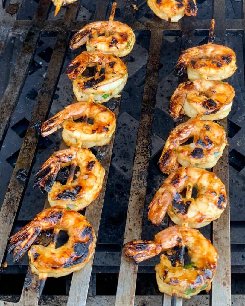 Grilled shrimp skewers on the grill.