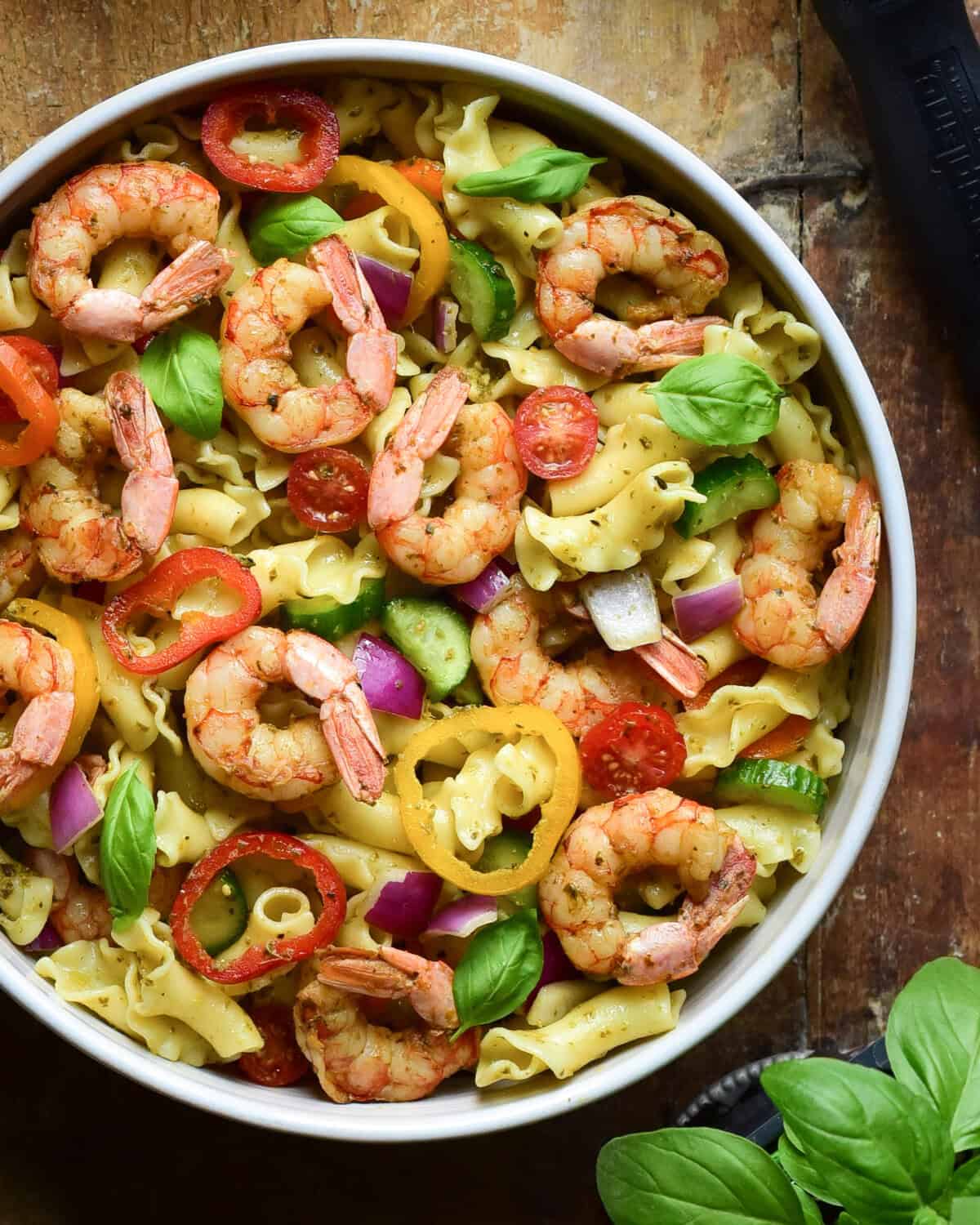 A close-up image of a Wild Argentinian Shrimp Pesto Pasta Salad.