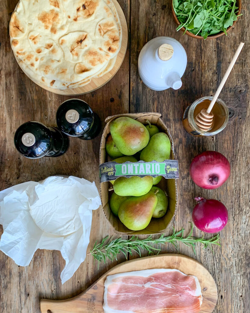 Ingredients to make naan pizzas.