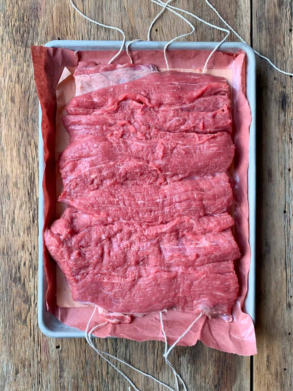 Cut the beef roast open to resemble a book and flatten out.