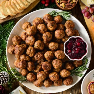 A platter of Air Fryer Sausage Meatballs with cranberry sauce.