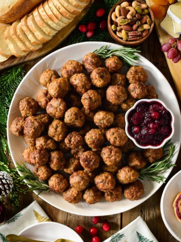 A platter of Air Fryer Sausage Meatballs with cranberry sauce.