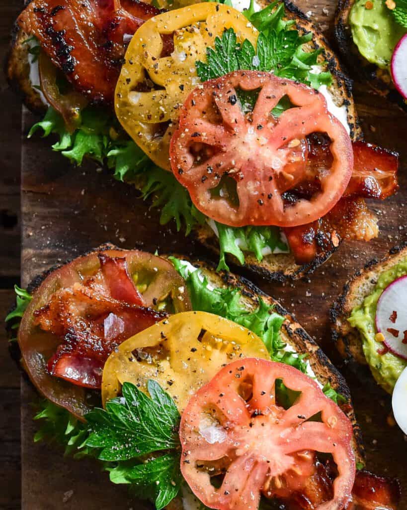 A close up image of BLT sourdough toast