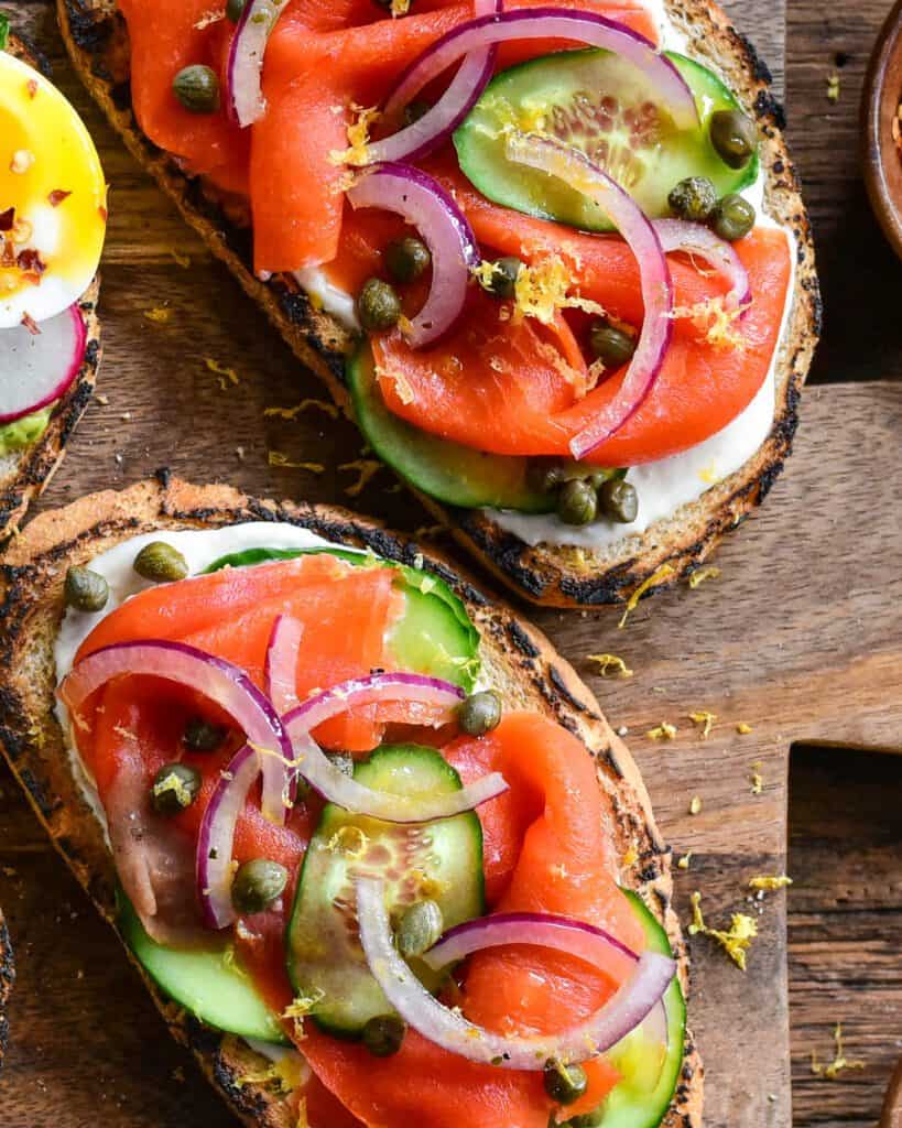 A close up image of smoked salmon on toast