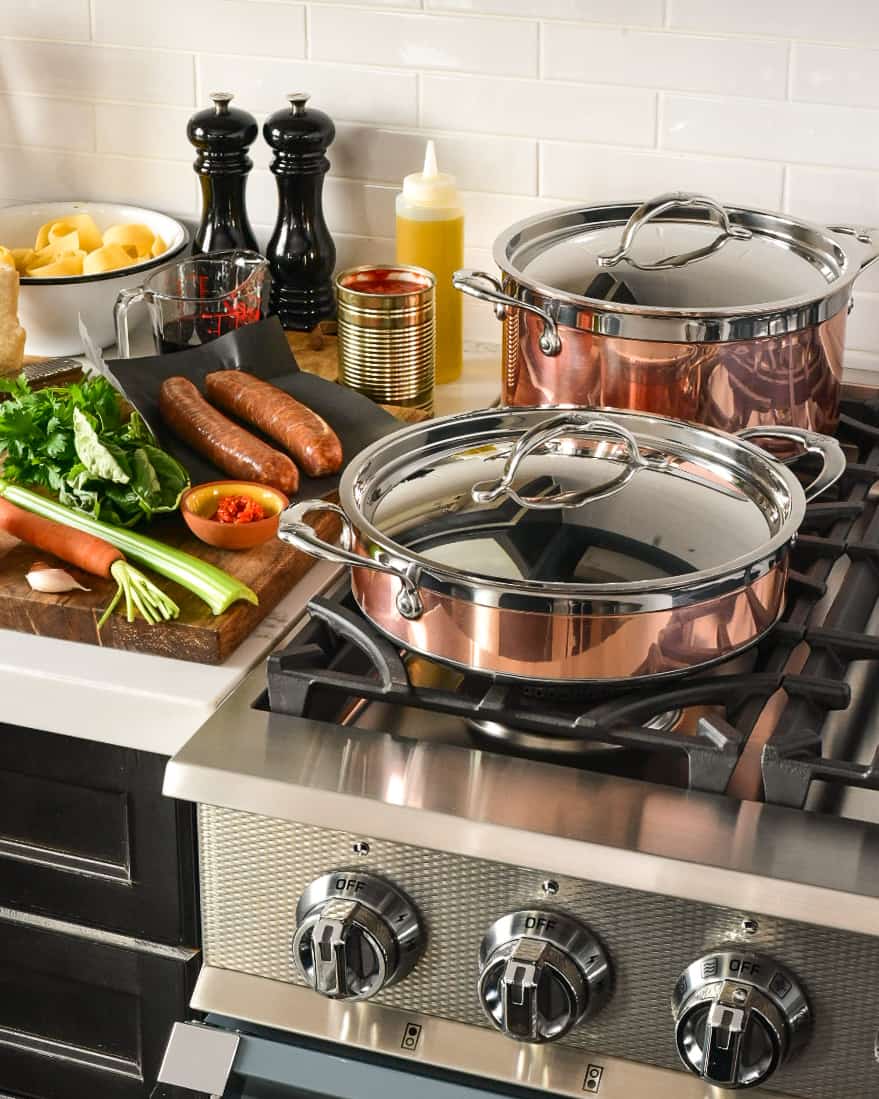 Ingredients and copper pots on the stove ready to go.