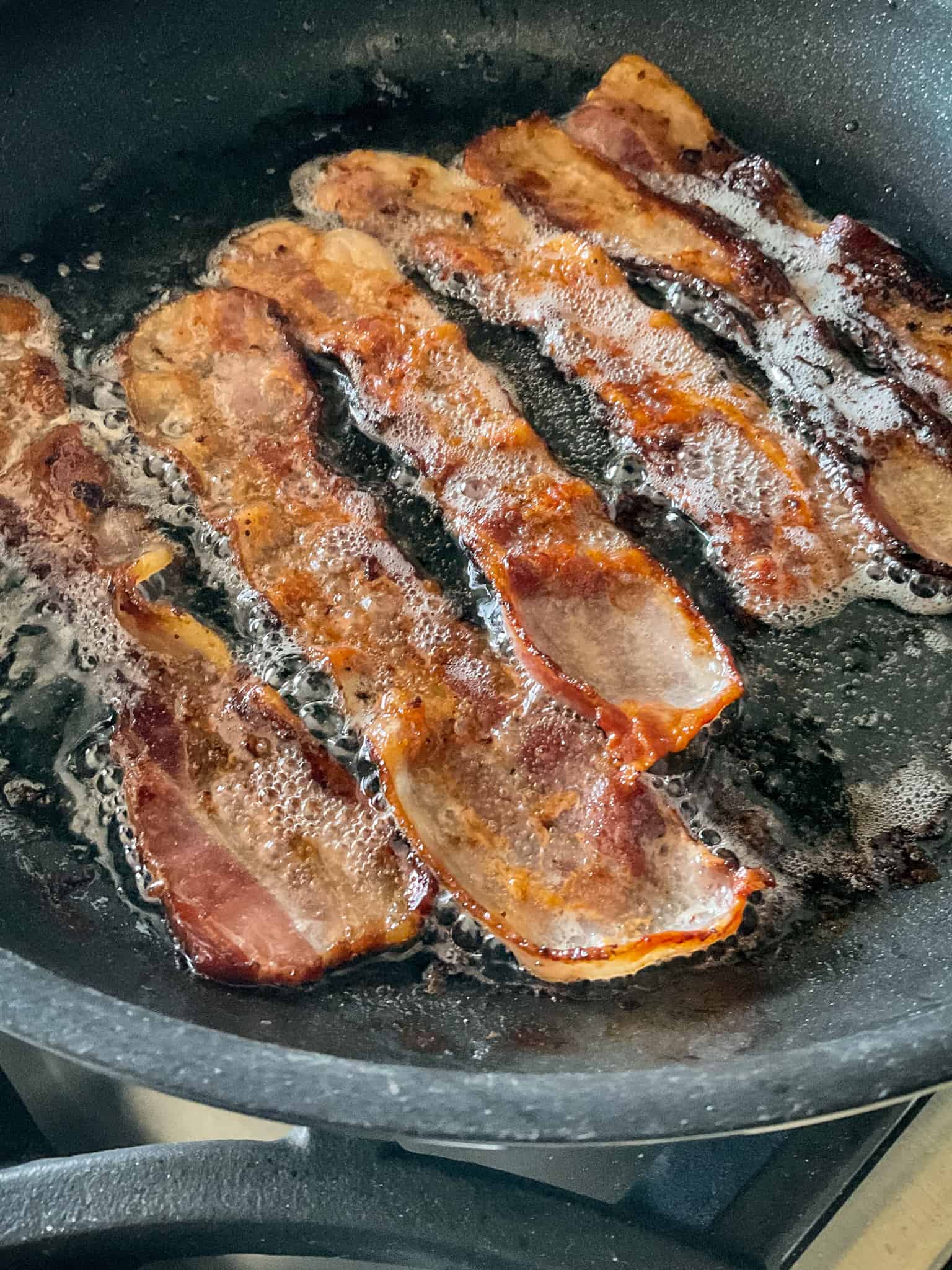 Cook the bacon slices until crisp.