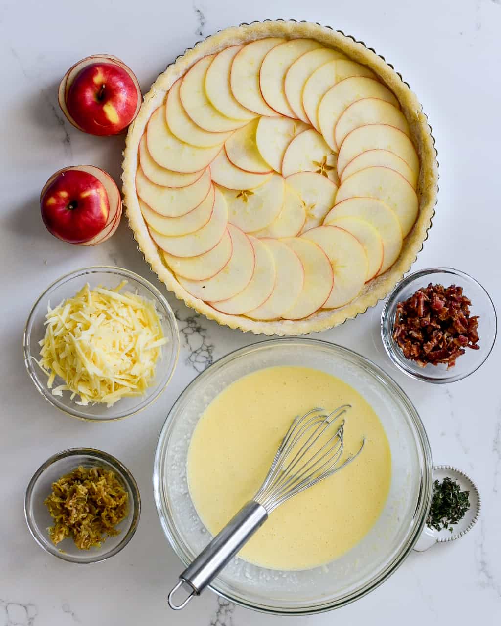 Layer the Honeycrisp apple slices in the bottom of the crust, overlapping each slice by about half, until the bottom is covered.