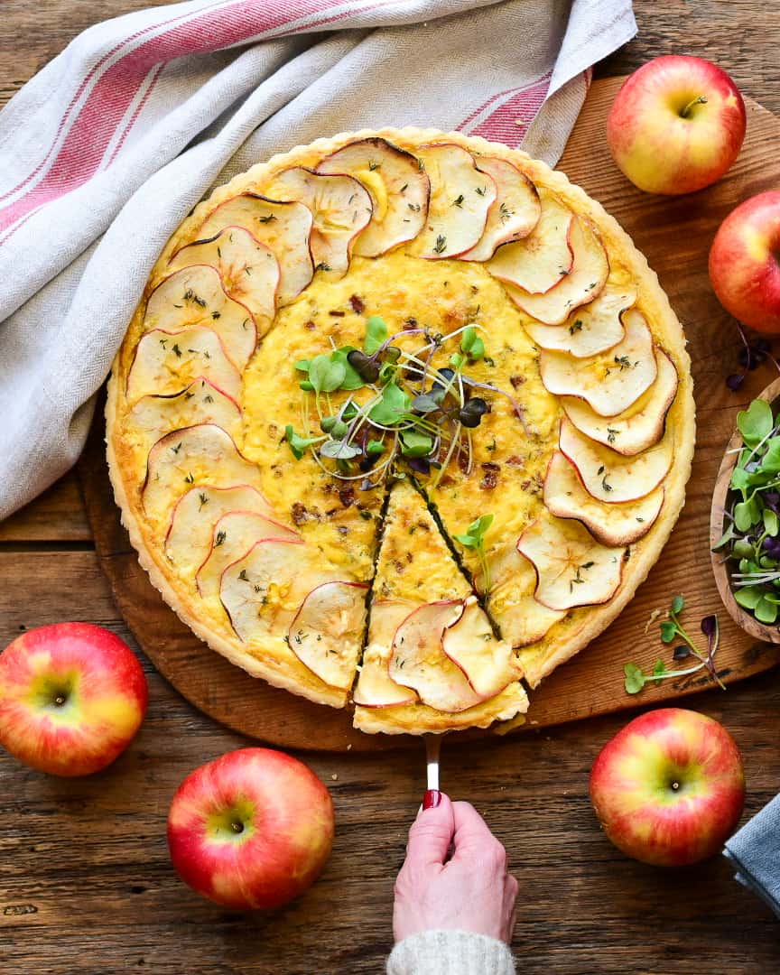 A top down image of a slice of the quiche