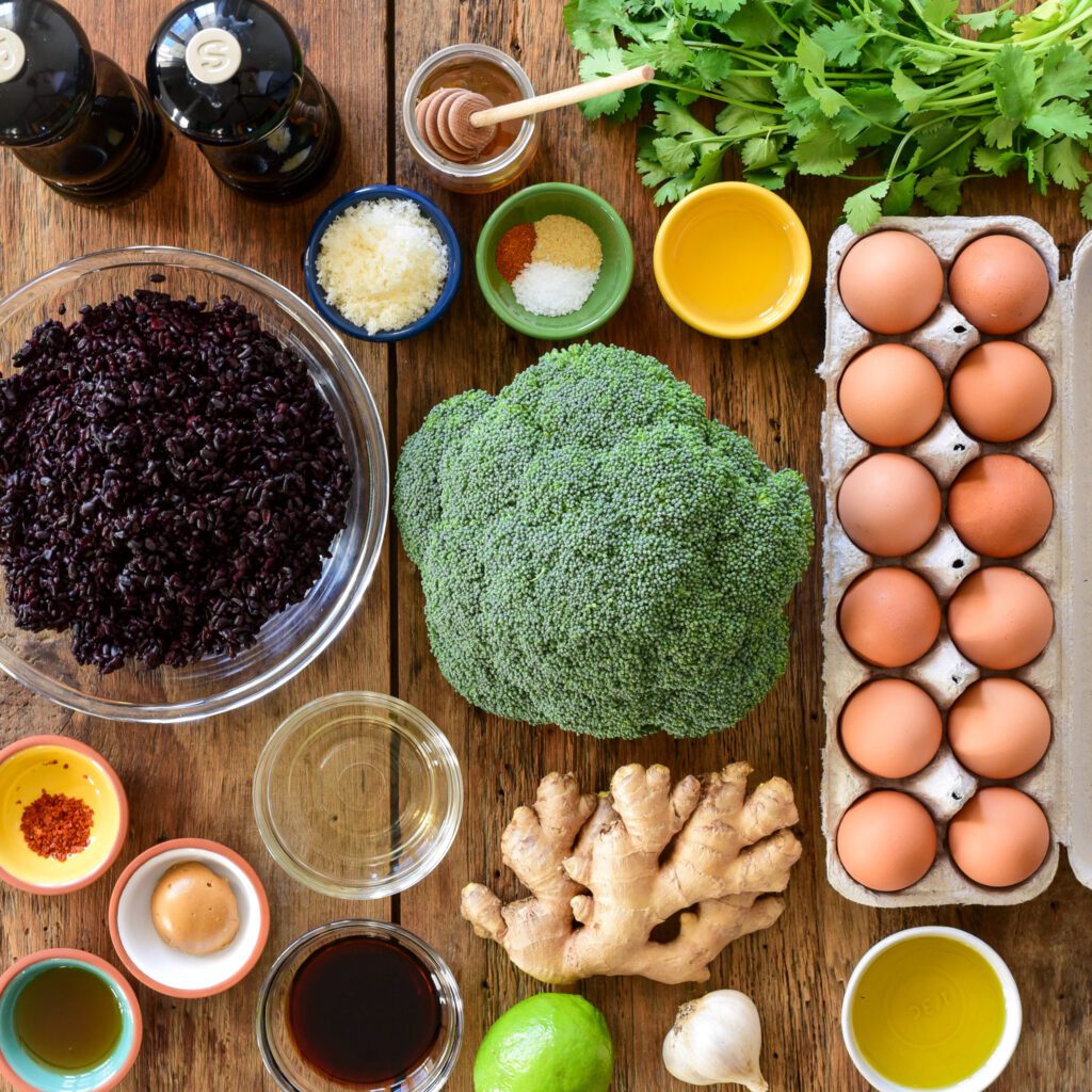 Ingredients laid out for this rice, egg and broccoli vegetarian dish.