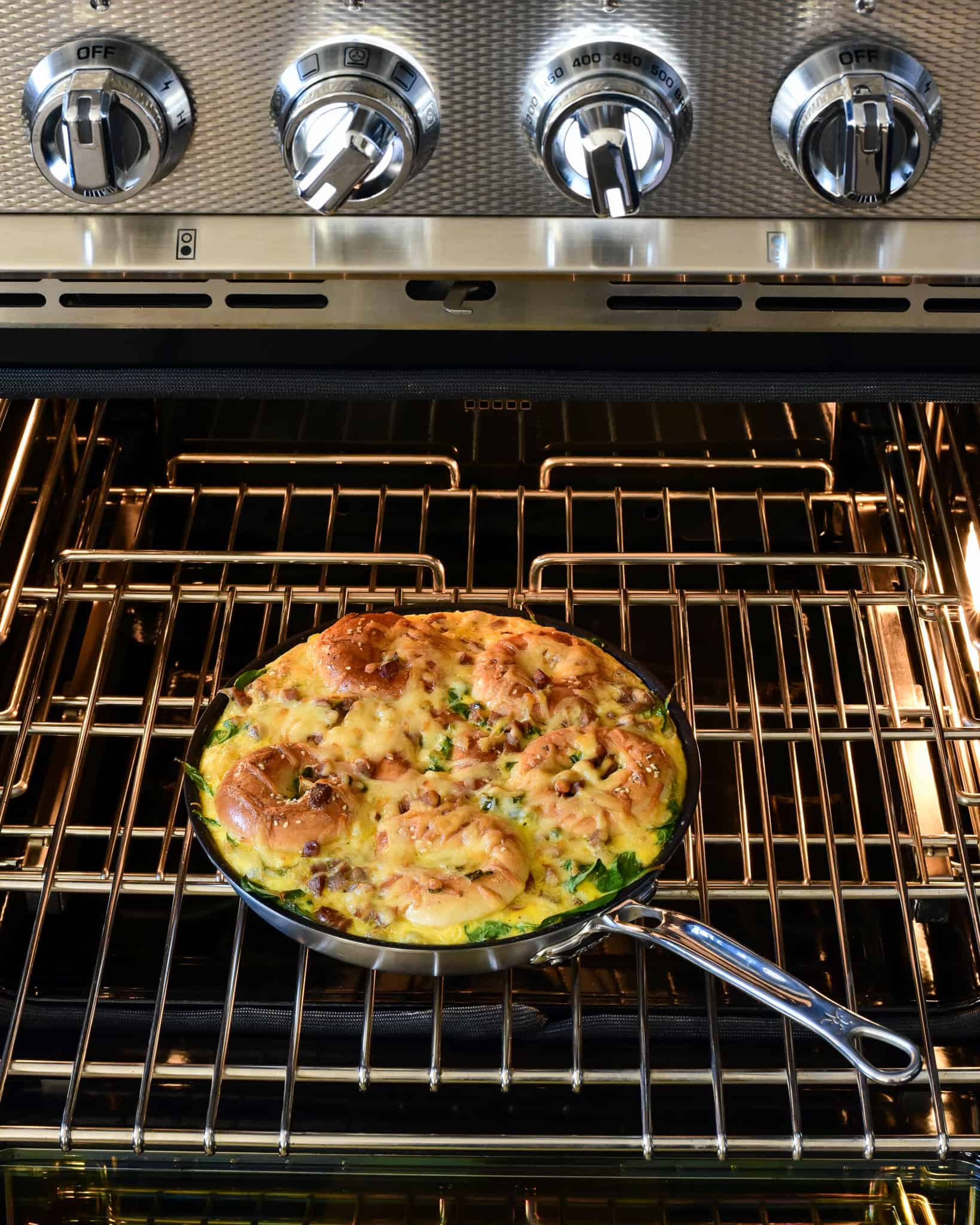 A skillet of a bagel bake in the oven